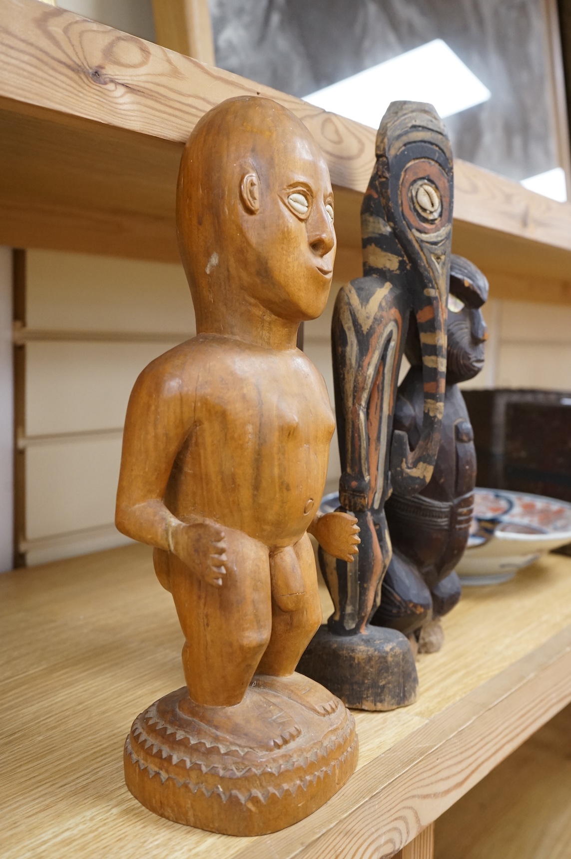 Three wood tribal figures, Africa, South Seas, tallest 37.5cm